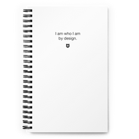 "I am who I am by design." Notebook